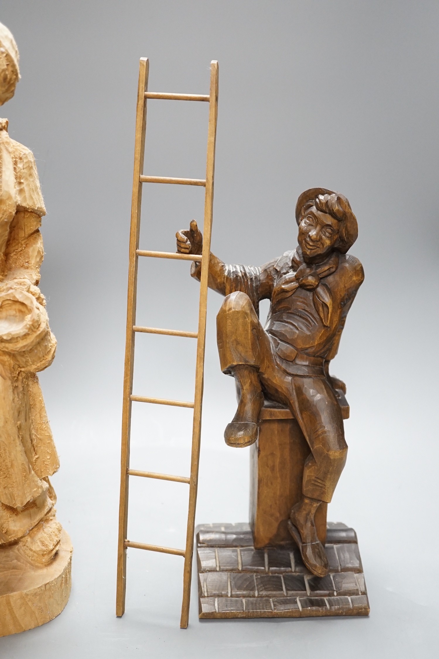 Two Black Forest carvings of a friar and a steeplejack, tallest 40cm